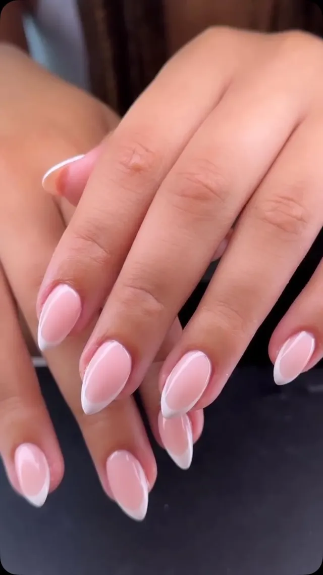 Pale pink almond nails with a French finish