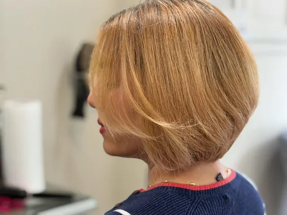 An A-line bob coloured a warm blonde at Dream Cutz