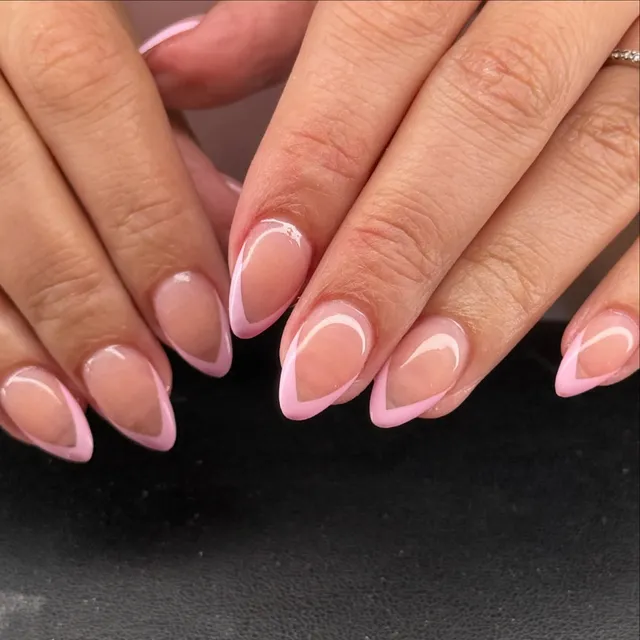 French-tip almond nails in a natural finish