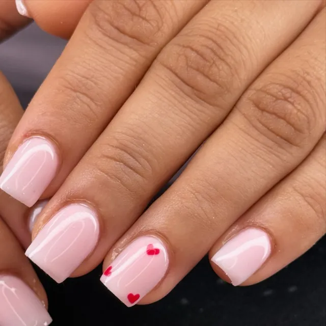 Pale nails finished with tiny hearts