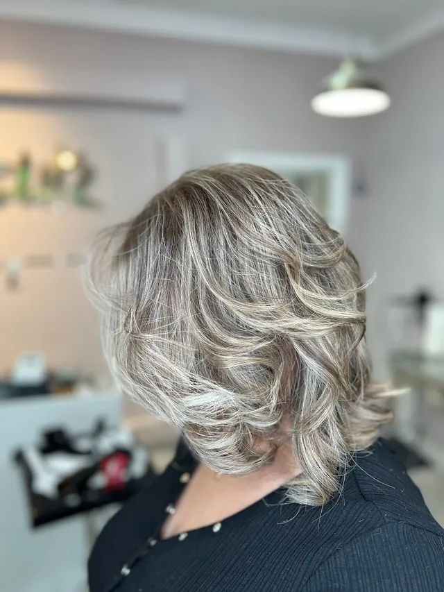 Ash-blonde layers coloured and finished
