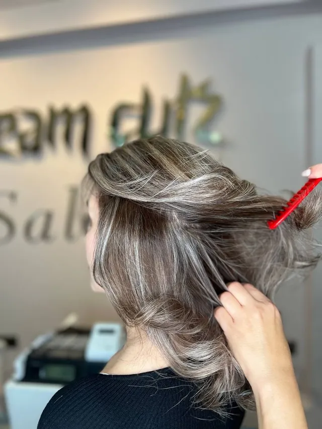 Balayage combed through at the styling chair