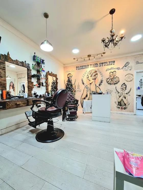 The barbering chairs and lit mirrors inside Dream Cutz