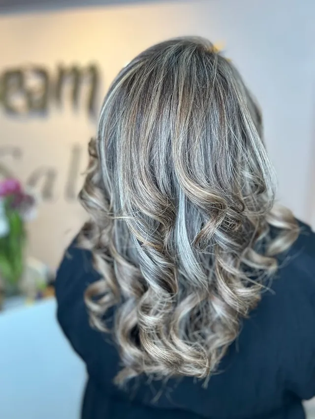 Ash-blonde layers with movement, viewed from behind